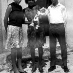 Grace Roberts. Barney Bethel on right. Who is the lady holding Sean?